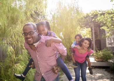 Happy family playing outside