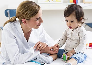 Female pediatrician with child